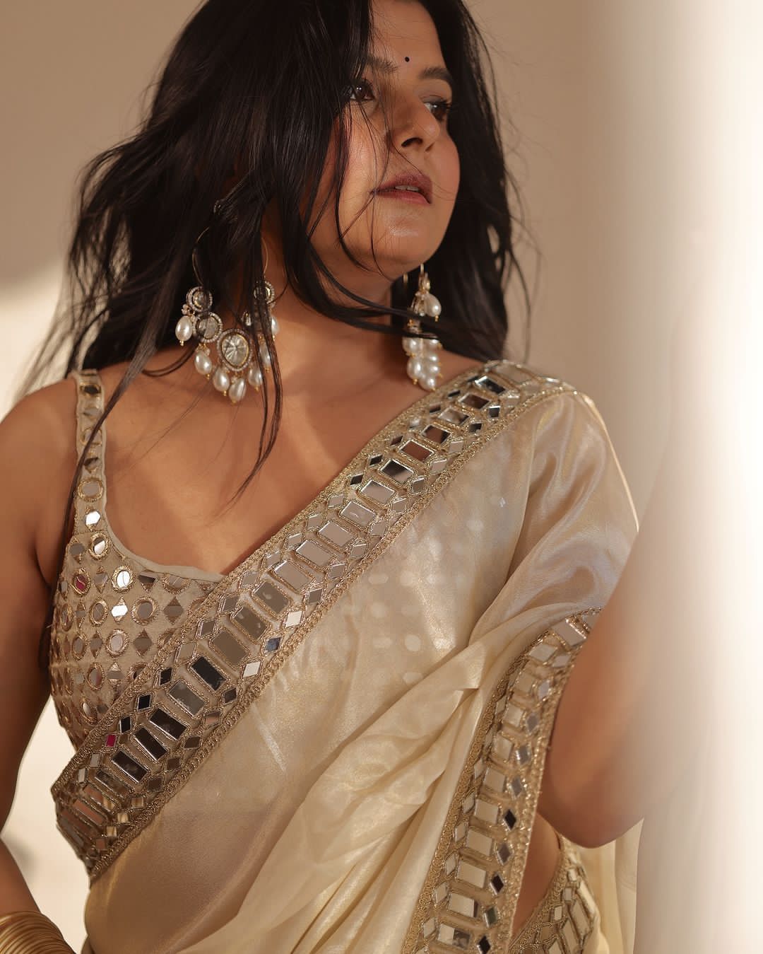 Sift satin Organza saree which is embedded with real mirror work Embroidery