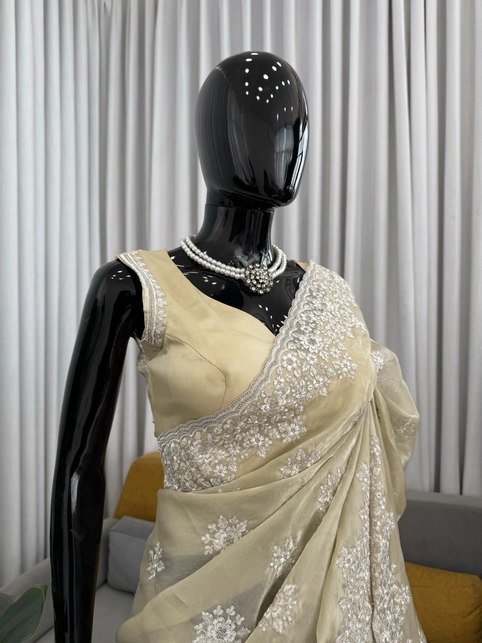 saree in an eye-catching shade, crafted with finesse and rich detailing. A perfect blend of grace and glam