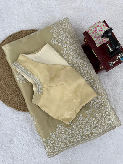 saree in an eye-catching shade, crafted with finesse and rich detailing. A perfect blend of grace and glam