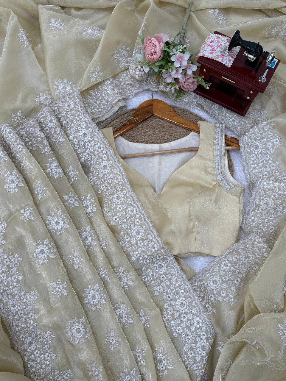 saree in an eye-catching shade, crafted with finesse and rich detailing. A perfect blend of grace and glam