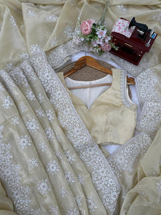 saree in an eye-catching shade, crafted with finesse and rich detailing. A perfect blend of grace and glam
