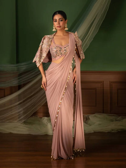 effortless luxury with this premium ready-to-wear saree. Expertly tailored with precise pleats and a refined finish, it delivers a sophisticated look without compromising comfort
