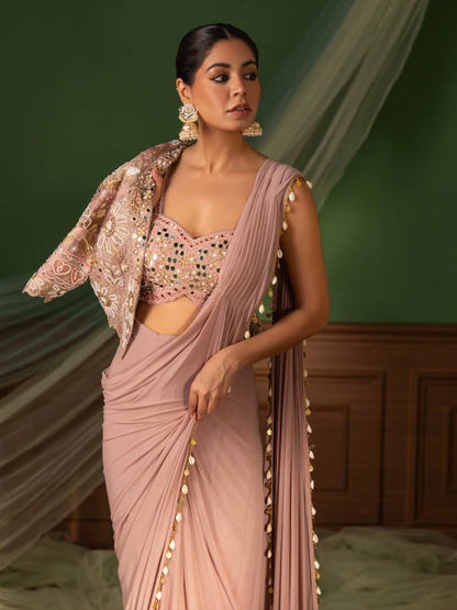 effortless luxury with this premium ready-to-wear saree. Expertly tailored with precise pleats and a refined finish, it delivers a sophisticated look without compromising comfort