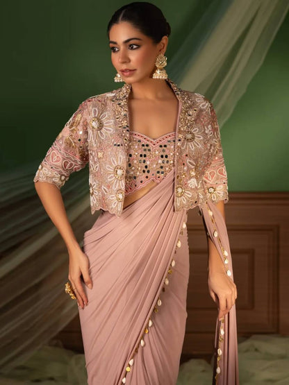 effortless luxury with this premium ready-to-wear saree. Expertly tailored with precise pleats and a refined finish, it delivers a sophisticated look without compromising comfort