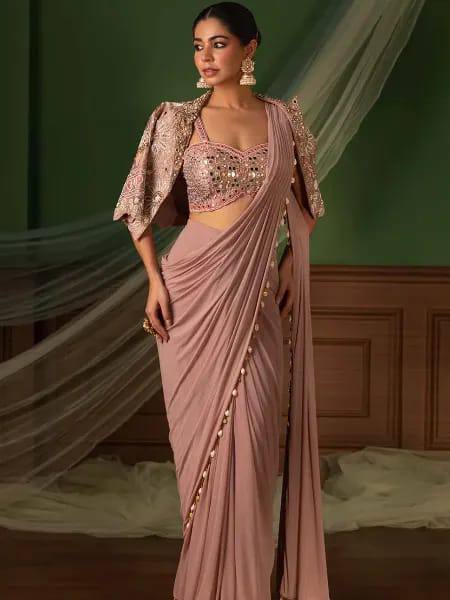 effortless luxury with this premium ready-to-wear saree. Expertly tailored with precise pleats and a refined finish, it delivers a sophisticated look without compromising comfort