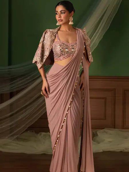 effortless luxury with this premium ready-to-wear saree. Expertly tailored with precise pleats and a refined finish, it delivers a sophisticated look without compromising comfort