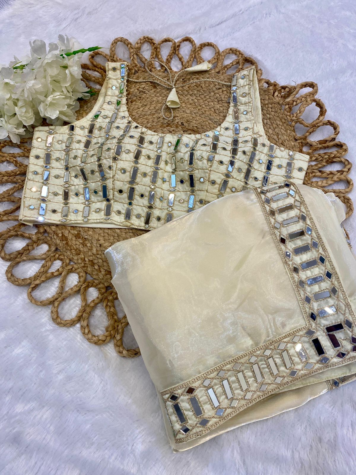 Sift satin Organza saree which is embedded with real mirror work Embroidery