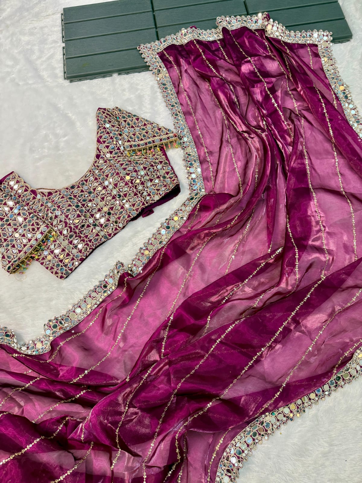 Soft satin Organza saree which is embedded with real mirror work Embroidery