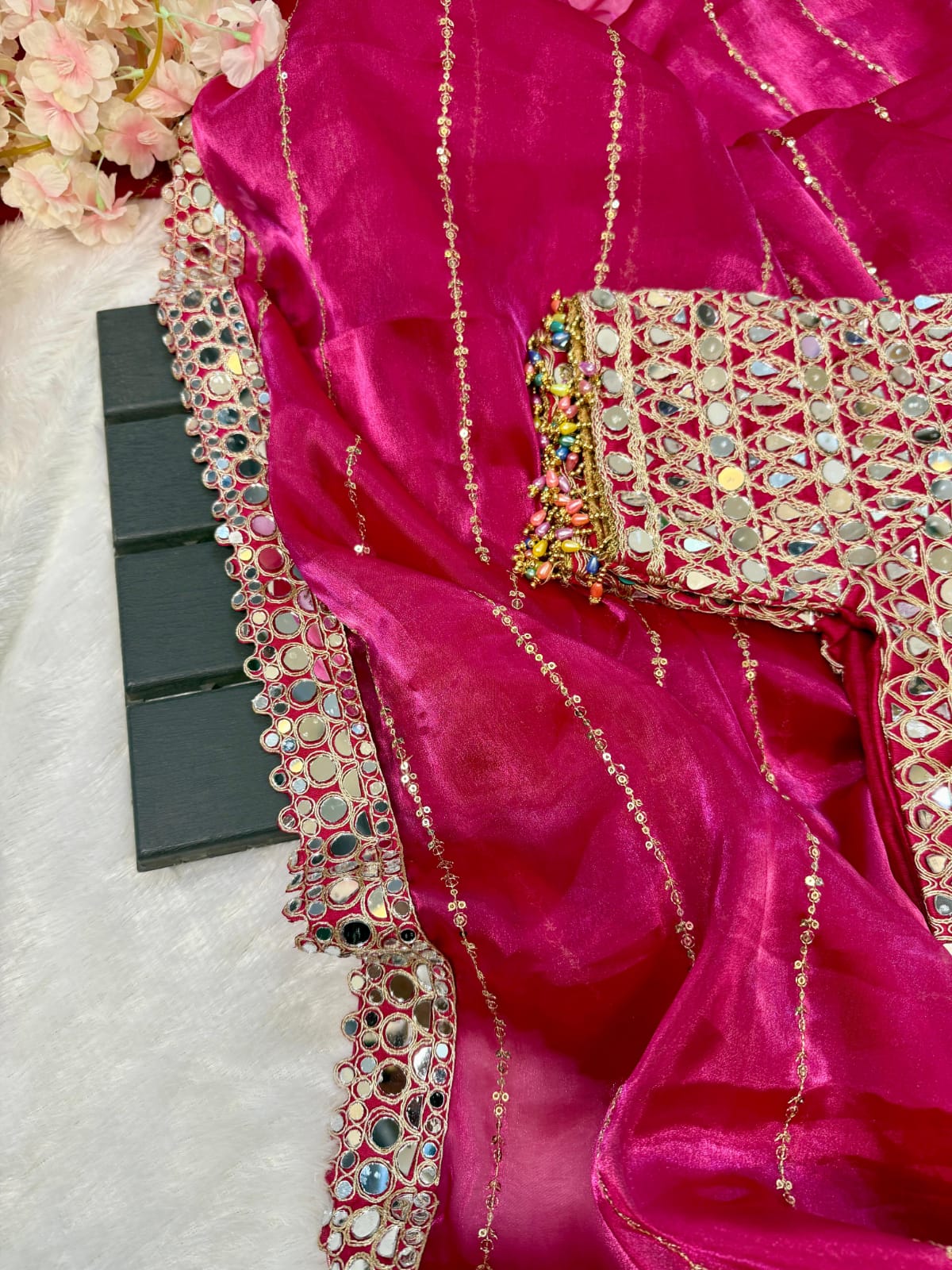 Soft satin Organza saree which is embedded with real mirror work Embroidery